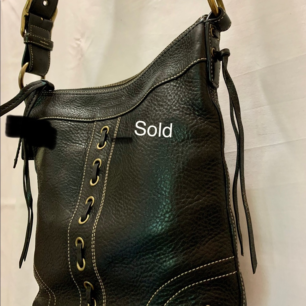 Black Original Coach crossbody bag.